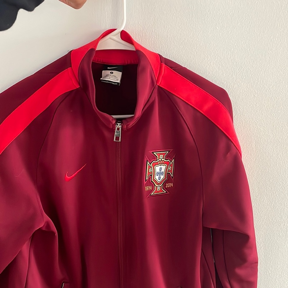 Red Nike zip up track jacket. Portugal soccer team 2014 World Cup